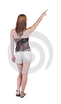 Back view of pointing woman.