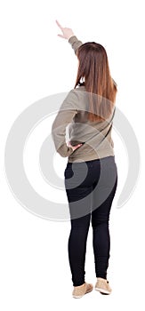 Back view of pointing woman.