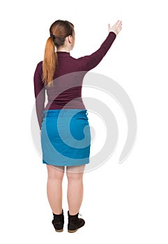 Back view of pointing woman