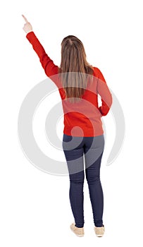 Back view of pointing woman.