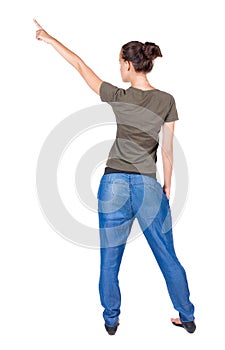 Back view of pointing woman.