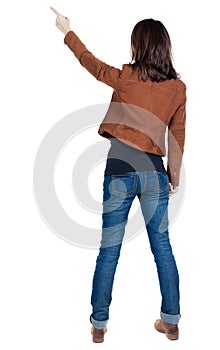 Back view of pointing woman.