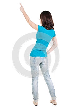 Back view of pointing woman.