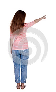 Back view of pointing woman.