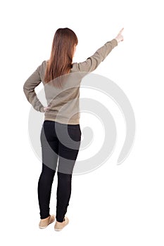 Back view of pointing woman. photo