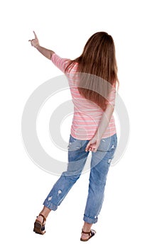 Back view of pointing woman.