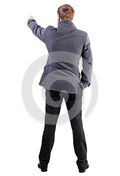 Back view of pointing young business men in coat