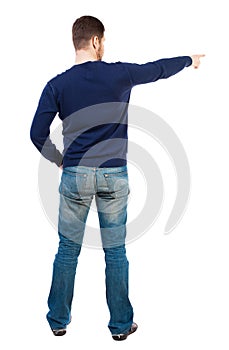 Back view of pointing young men in jeans