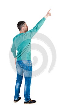 Back view of pointing young men in jeans.