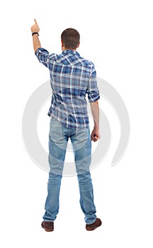 Back view of pointing young men in shirt and jeans.