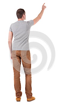 Back view of pointing young men in shirt and jeans