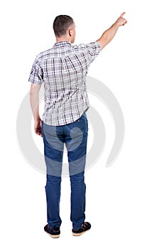 Back view of pointing young men in shirt and jeans.