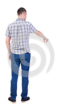 Back view of pointing young men in shirt and jeans.