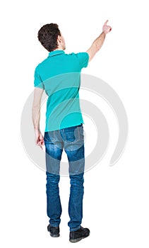 Back view of pointing young men in shirt and jeans. Young guy