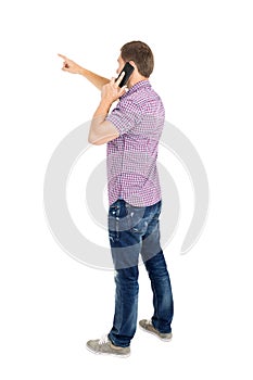 Back view of pointing young men talking on phone