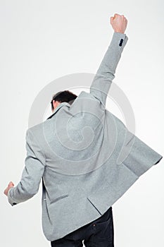 Back view portrait of a businessman celebrating his success