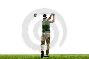 back view portrait of golfer in retro outfit with golf club taking shot against white studio background. Male golf