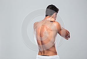 Back view portrait of a man with neck pain