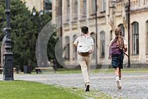 Back view of preteen schoolkids 