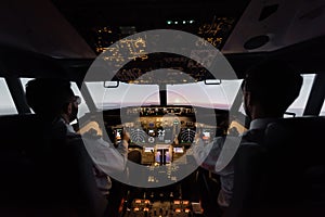 back view of professionals piloting modern