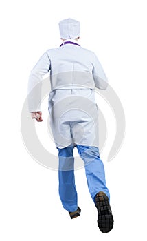 Back view of running doctor in a robe hurrying to help the patie photo