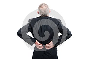 Back view of senior holding his back like hurting