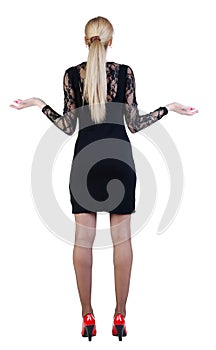 Back view of shocked business woman in dress .