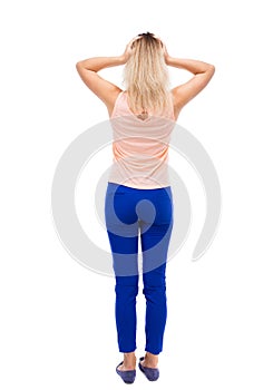 Back view of shocked woman.