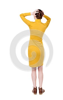 Back view of shocked woman in dress.