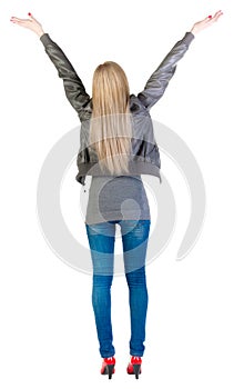 Back view of shocked woman in gray jacket