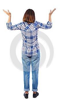 Back view of shocked woman in jeans.