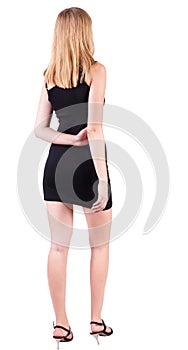 Back view of standing beautiful blonde business woman