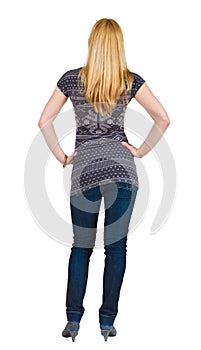 Back view of standing beautiful blonde woman.