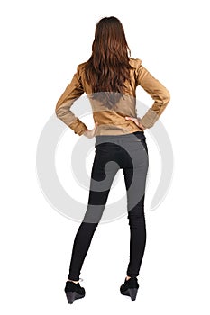 Back view of standing beautiful brunette woman.