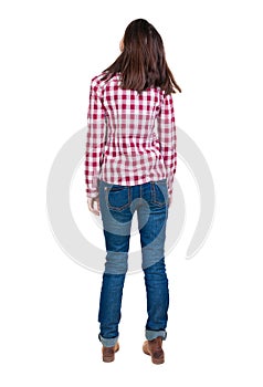 Back view of standing young beautiful brunette woman in checker