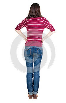 Back view of standing young beautiful brunette woman in red pul