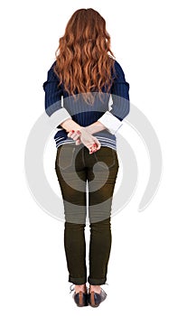 Back view of standing young beautiful redhead woman.