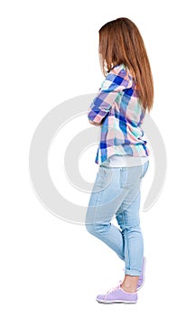 Back view of standing young beautiful redhead woman.