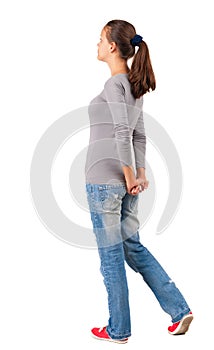 Back view of standing young beautiful woman.