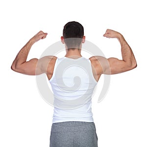 Back view of strong man in undershirt flexing his biceps