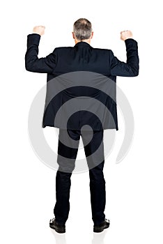 Back view successful businessman with arms up