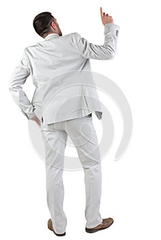 Back view of thinking young business man in white suit.