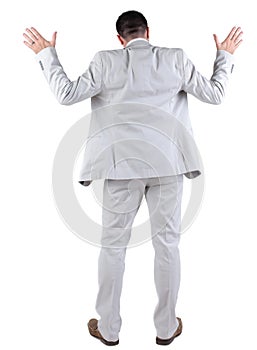 Back view of thinking young business man in white suit.