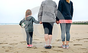 Three generations female watching the sea