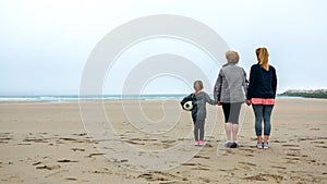 Three generations female watching the sea