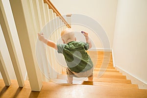 Toddler boy first time n his life going down the stairs