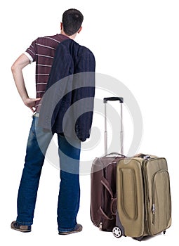 Back view of traveling busness man with suitcase