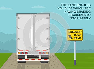 Back view of a truck on a runaway truck ramp. The lane enables vehicles which are having braking problems.