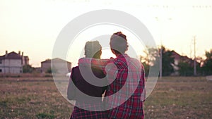 Back view of two best friends hugging each other. Happy young woman hug showing love and affection. Slowmotion shot