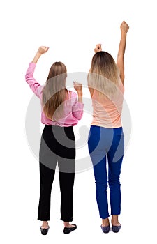 Back view of two young women dancing.